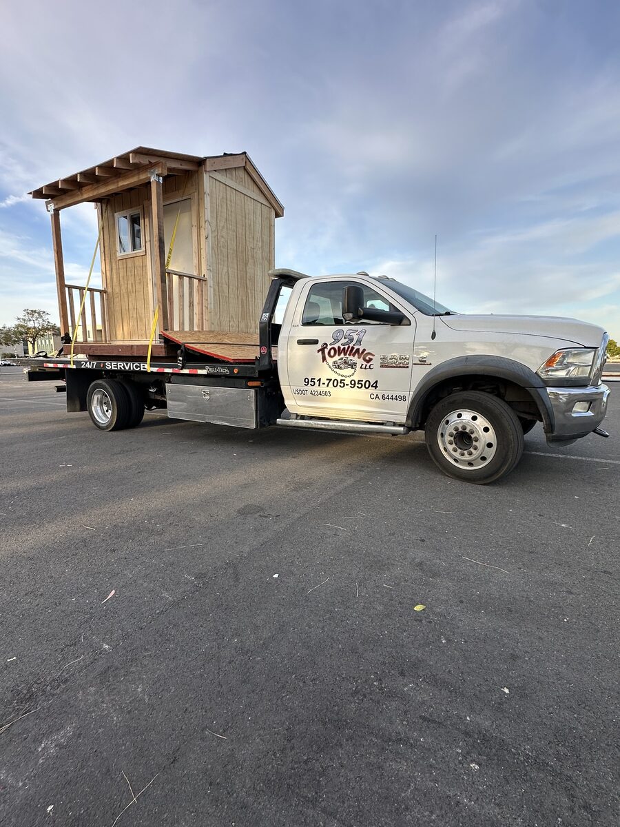 951 Towing truck hauling equipment